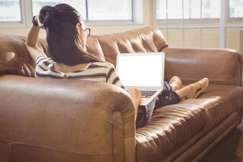 businesswoman relaxing on sofa with transparent laptop - Download Free Stock Videos Pikwizard.com