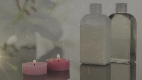 Relaxation Bottles and Candles in Sparkling Setting