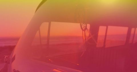 Dream catcher in van with sunset gradient - summer road trip theme