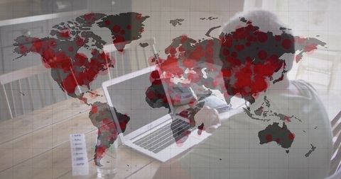 World map overlay with senior man video calling on laptop