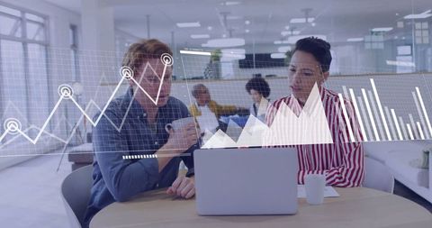 Professionals Analyzing Data in Contemporary Office Environment