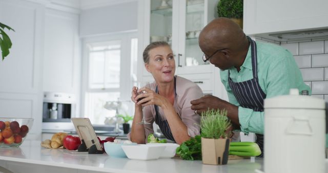 Smiling Couple Preparing Healthy Meal in Modern Kitchen - Download Free Stock Images Pikwizard.com