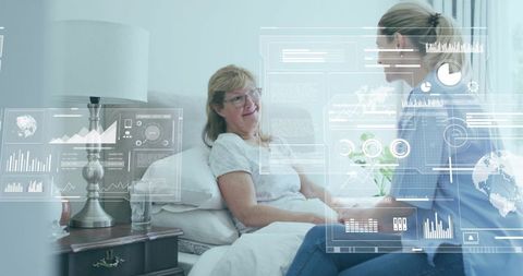 Caregiver Analyzing Digital Data Points Beside Patient in Bedroom