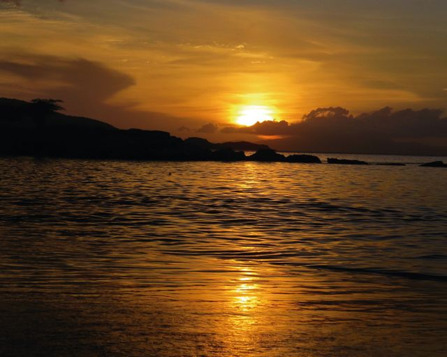 Stunning Golden Sunset Over Tranquil Ocean Waters - Download Free Stock Photos Pikwizard.com