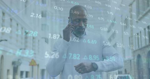 an african american businessman checks his smartwatch while on a phone call in a city setting, overlaid with financial and numerical data, representing global connections and digital technology. ideal for illustrating concepts of business, data analysis, finance, technology, and urban work environments.