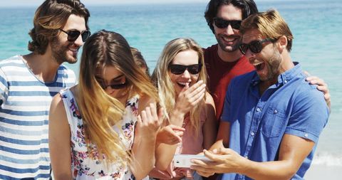 Joyful Young Adults Enjoying Beach Selfie Moment in Sunshine - Download Free Stock Images Pikwizard.com