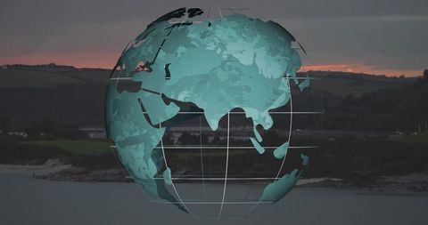 Floating translucent teal globe hovering over coastal bay at twilight with gridlines
