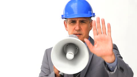 Businessman with Blue Helmet Using Megaphone for Communication
