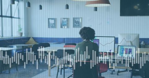 African american businesswoman analyzing data in modern office