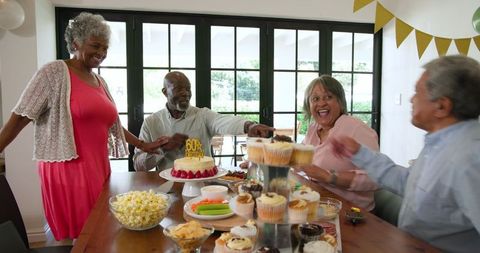 Joyful Senior Friends Celebrating Birthday Party Together