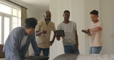 Friends Packing Suitcase for Wedding Trip with Teamwork Happiness