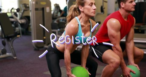 Squatting duo holding medicine balls training together in gym with register overlay