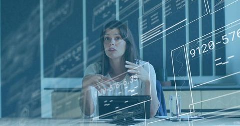 Midadult woman presenting analytics with tablet and translucent ui overlays in office