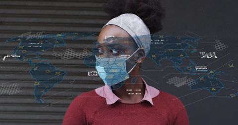 Woman wearing face mask and headband viewing augmented reality world map data overlay