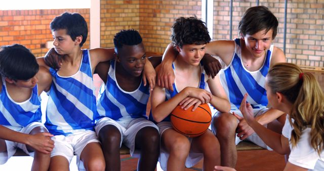 Youth Basketball Team Receiving Coaching in Gym - Download Free Stock Images Pikwizard.com