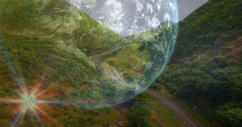 Spinning Globe Overlay on Scenic Winding Road Landscape