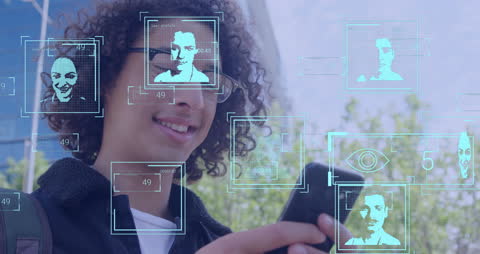 Young Professional Engaged with Advanced Facial Recognition Technology