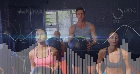 Group medicine ball training in industrial gym with futuristic data overlay
