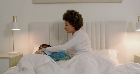 Mother Reading to Daughter in Cozy Bedtime Scene