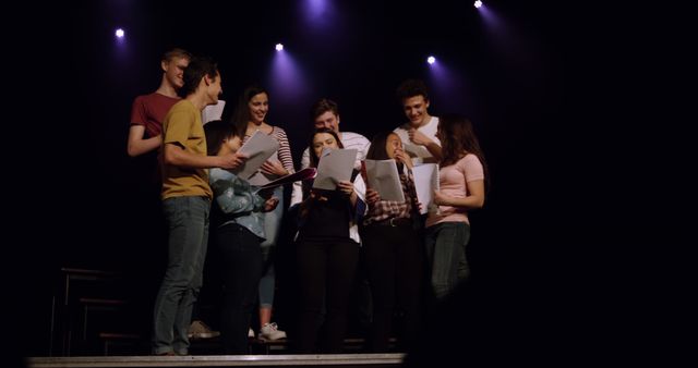 Group of Young Actors Rehearsing on Stage Under Purple Lights - Download Free Stock Images Pikwizard.com