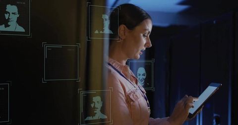 Technician working in futuristic data center with holograms