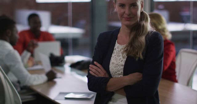 Confident Businesswoman with Colleagues in Meeting - Download Free Stock Images Pikwizard.com