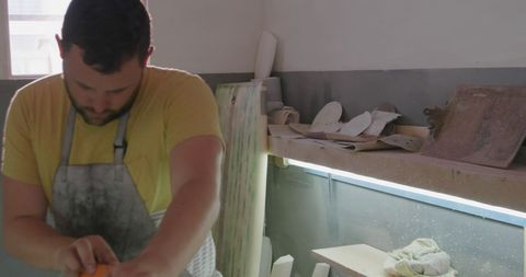 Caucasian Potter Sculpting Clay in Home Studio