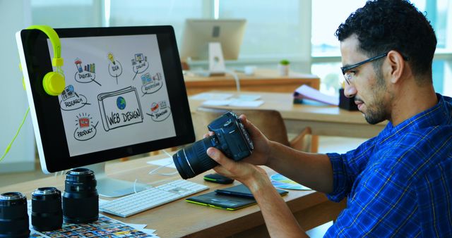 Web Designer Reviewing Camera Equipment in Modern Office - Download Free Stock Images Pikwizard.com