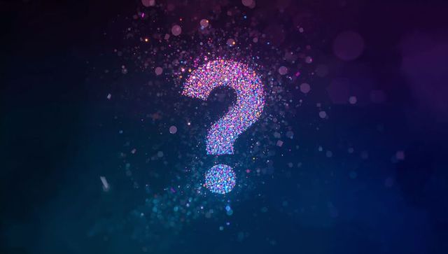 Glowing Question Mark with Colorful Particle Illumination