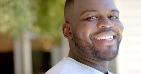 Smiling Man Enjoying Outdoors on a Sunny Day