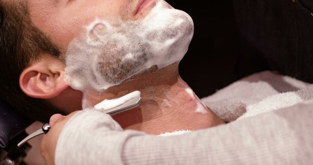 Man Receiving Professional Shave at Barber Shop - Download Free Stock Images Pikwizard.com