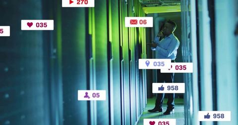 Businessman communicating in a data center surrounded by icons