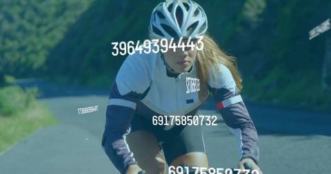 Focused Cyclist on Mountain Ride with Data Overlays