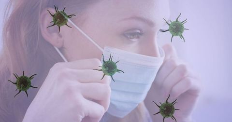 Woman Wearing Face Mask Surrounded by Virus Particles