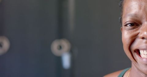 Strong Fit Woman Smiling in Gym Embracing Fitness and Well-Being