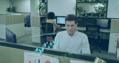 Office Professional Analyzing Data on Interactive Overlay