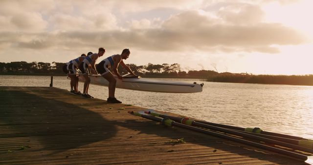 Team of Rowers Preparing Boat for Early Morning Practice on Lake - Download Free Stock Images Pikwizard.com