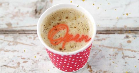 Vintage cafe mug with frothy coffee and neon open sign effect
