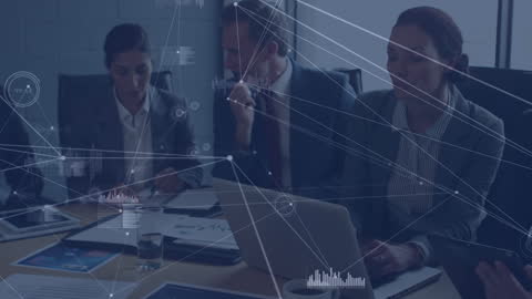 Diverse Team Discussing Network Data with Digital Interface Overlay