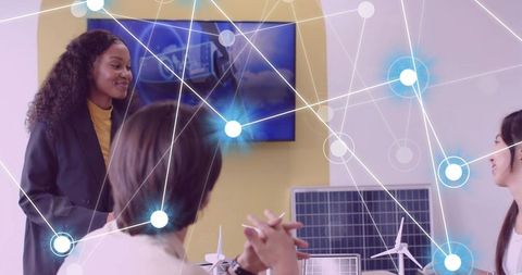 Diverse team discussing sustainable innovation and renewable energy