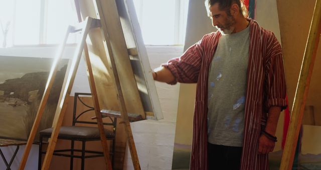 Male Artist Painting on Canvas in Sunlit Studio - Download Free Stock Images Pikwizard.com