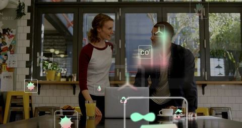 Two professionals discussing ideas over laptop in bright cafe with ar interface overlays