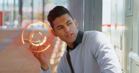 Man interacting with futuristic holographic interface