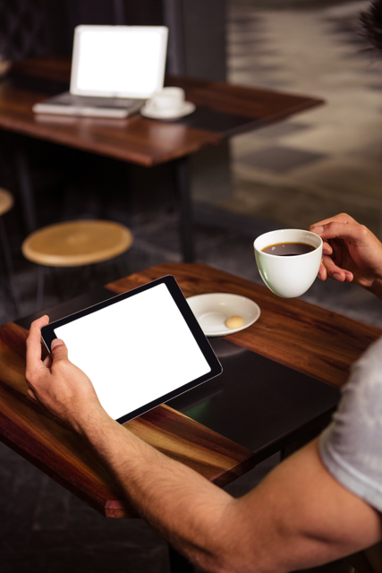 Arm Holding Tablet and Coffee in Cafe with Transparent Screen - Download Free Stock Videos Pikwizard.com