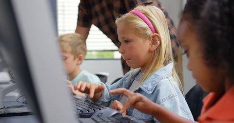 Male Teacher Guiding Children on Computers in Classroom - Download Free Stock Images Pikwizard.com