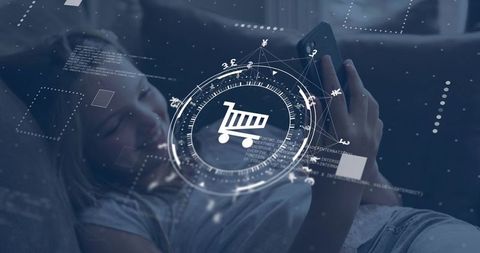 Girl reclining on sofa holding smartphone, browsing ecommerce with digital cart hud