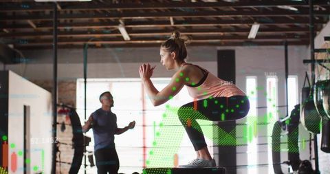Athlete doing squat on plyometric box in gym with digital analytics overlay