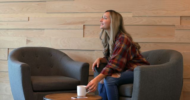 Smiling Woman Sitting in Café with Coffee and Phone on Table - Download Free Stock Images Pikwizard.com