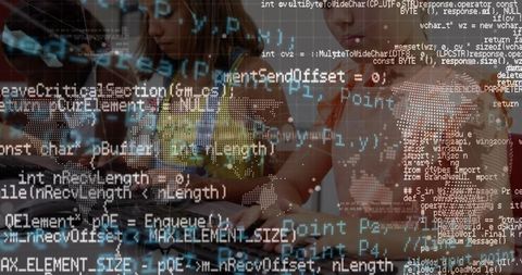 Collaborating Group of Young Women Focus on Coding in Digital Classroom