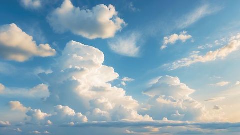 Majestic Cumulonimbus Clouds Ascending in Clear Blue Sky
